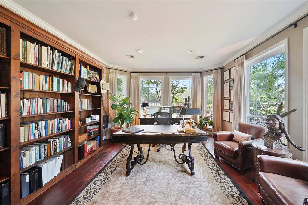 Private office w/ bay windows, French doors & built-ins!