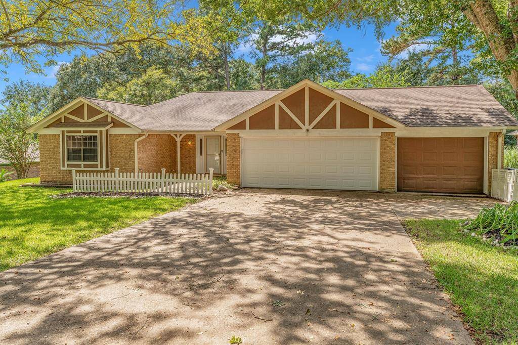 Charming single-story home featuring a welcoming front porch and a two-car garage