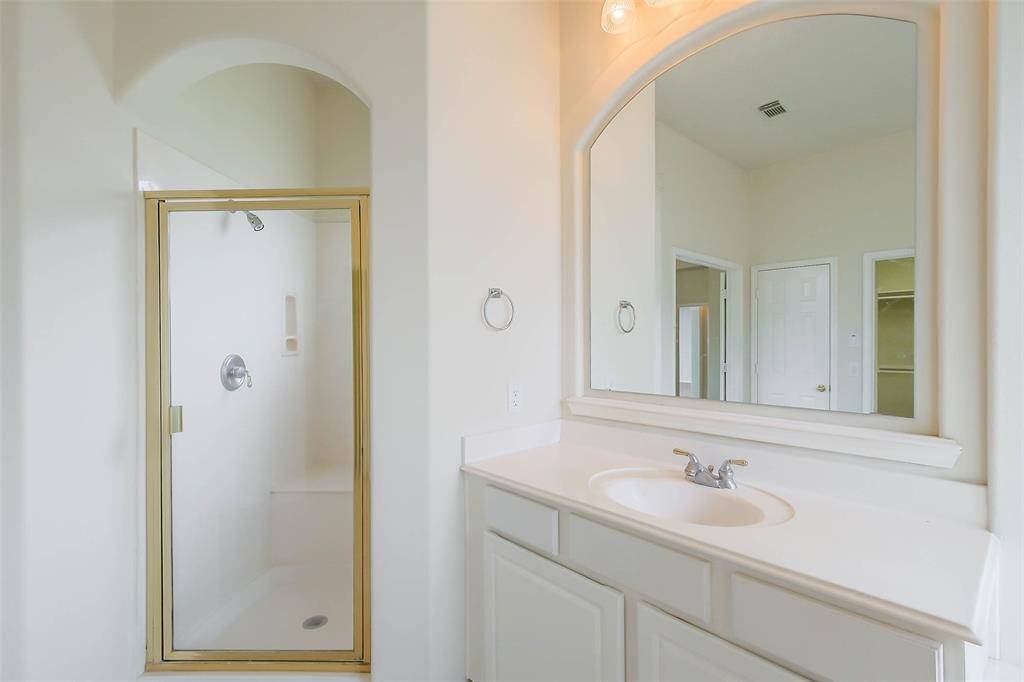 Primary Bedroom standing shower and sink