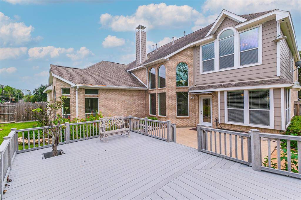 A spacious deck, perfect for gatherings, offers ample seating and relaxing ambiance for unwinding during peaceful evenings
