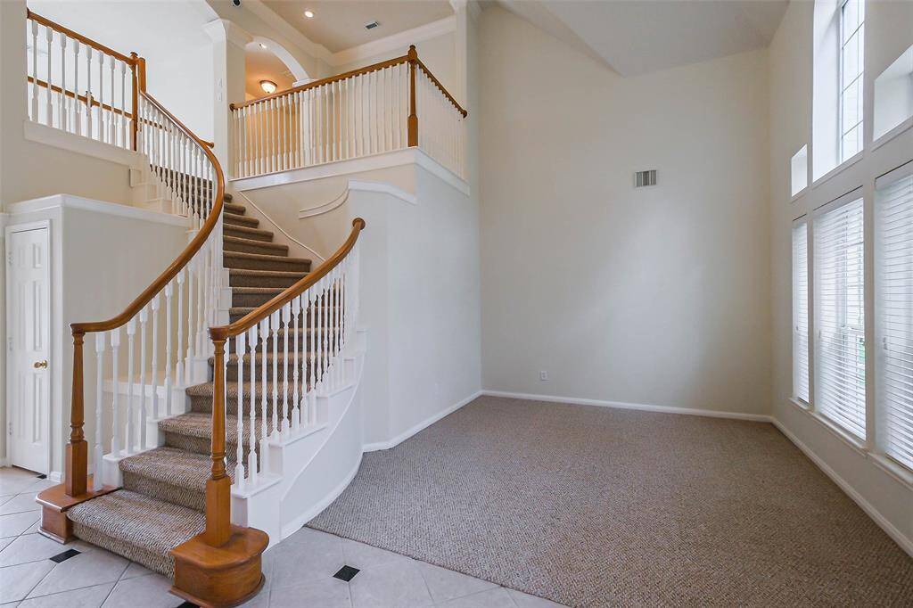 Spiral stairway overlooking the study below