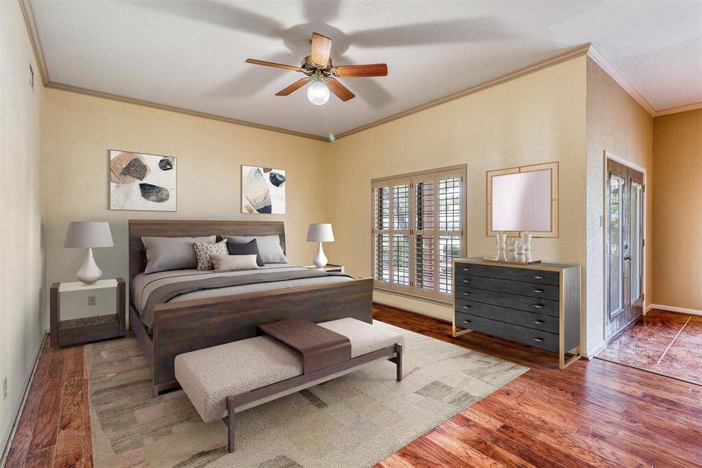 Primary Bedrooom with doors that lead to the patio.