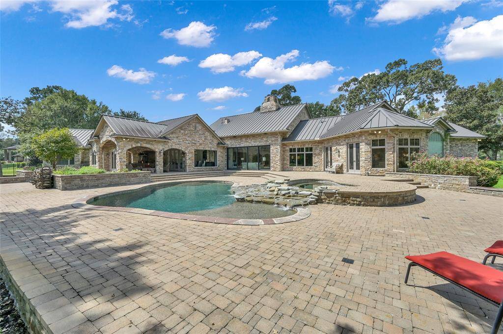 Backyard view of the house overlooking the inviting pool.