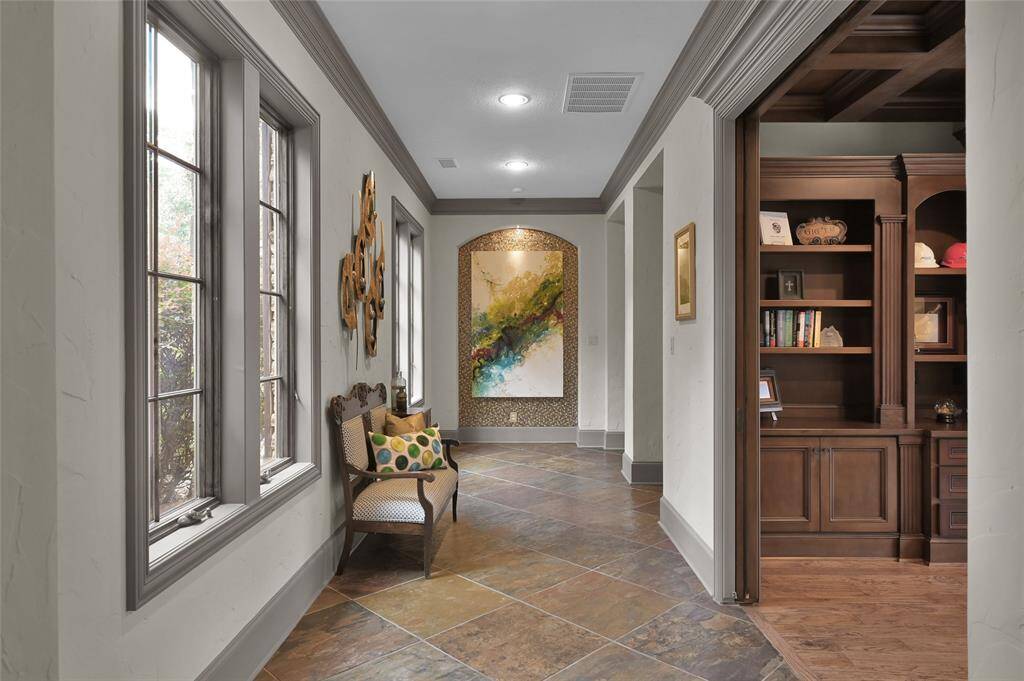 Gallery hallway adjacent to the foyer, with office on the right.