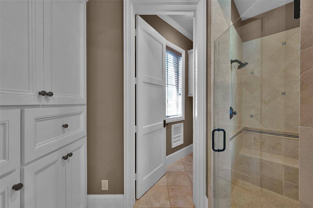 Primary bathroom also has separate shower, water closet and linen closet.