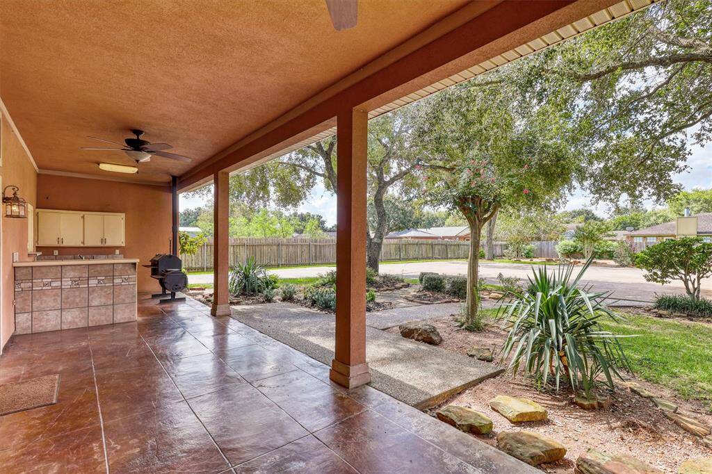Outdoor Patio and Kitchen with built-in smoker and BBQ pit.