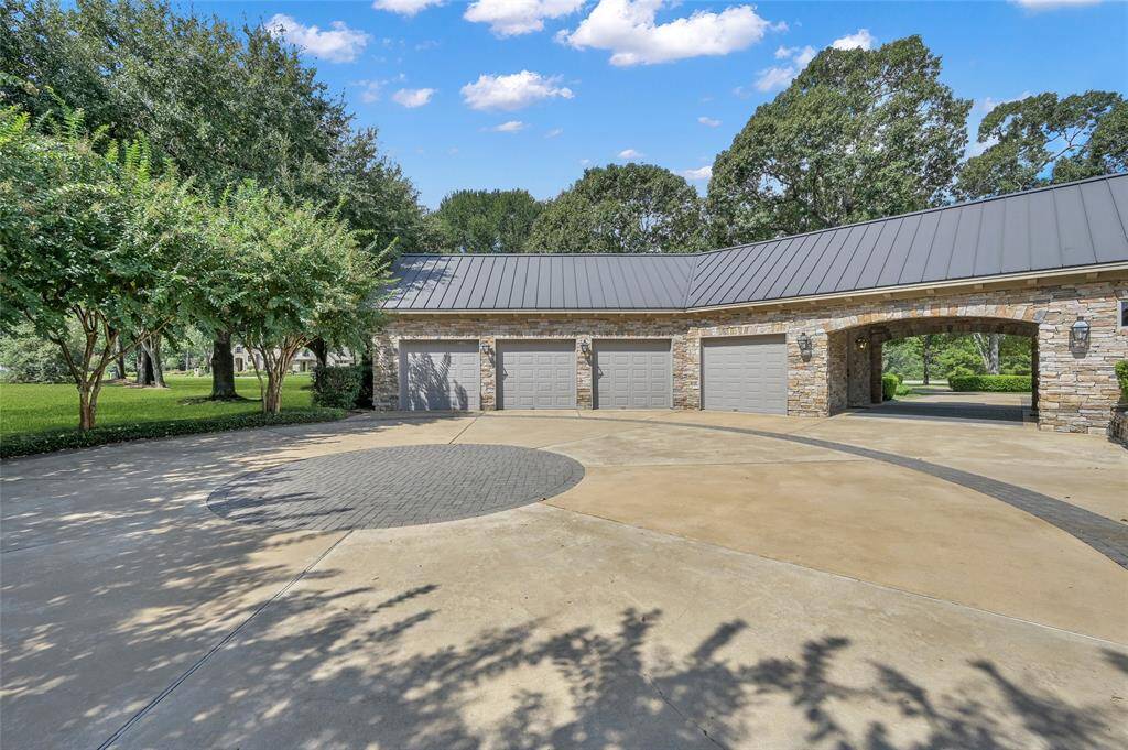 The motor court offers ample space for parking and easy access to the garage, courtyard and putting green.