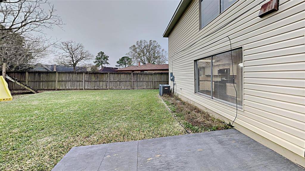 Spacious backyard oasis, ideal for hosting gatherings and outdoor enjoyment.