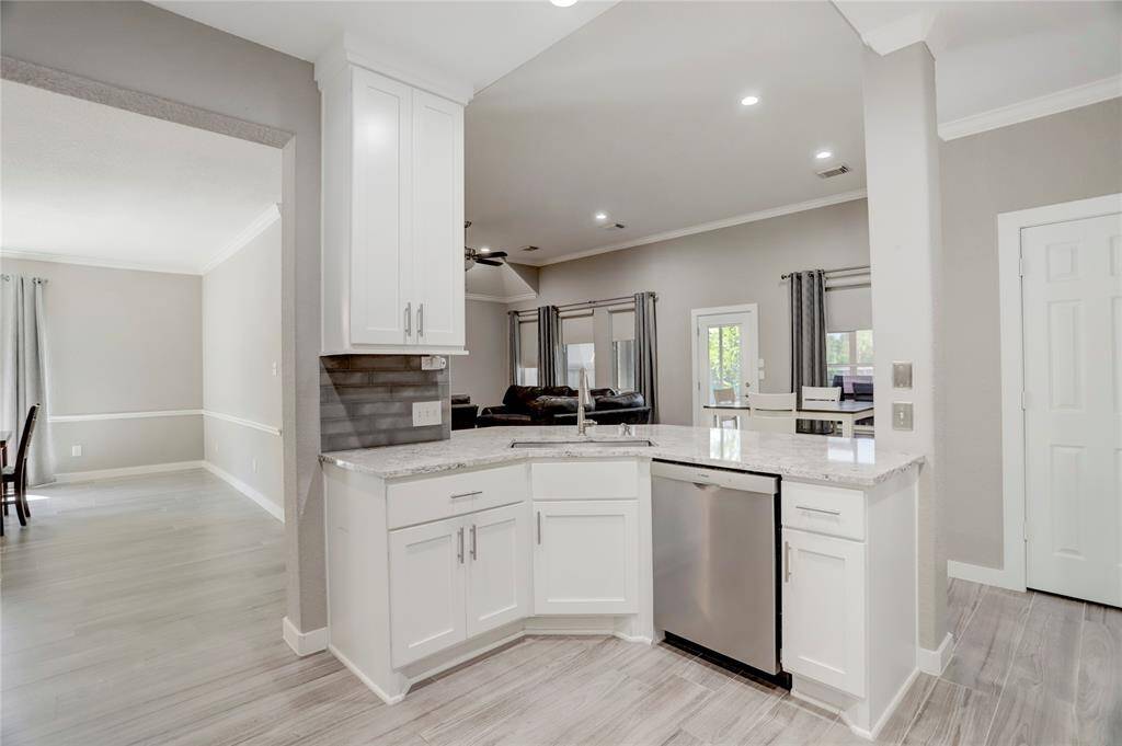 YOU WILL NEVER MISS ANY OF THE ACTION IN THIS OPEN KITCHEN!