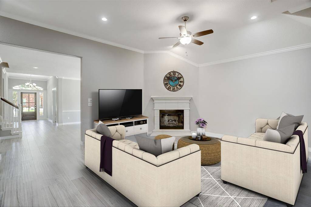 TILE GASLOG FIREPLACE PROVIDES A COZY SPOT TO CURL UP WITH A GOOD BOOK.**This room has been virtually staged.