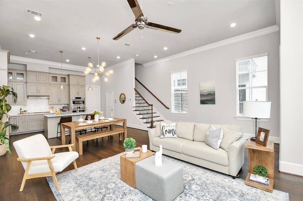 Spacious first-floor living area with an open layout, seamlessly connecting the living room, dinning area, and kitchen.