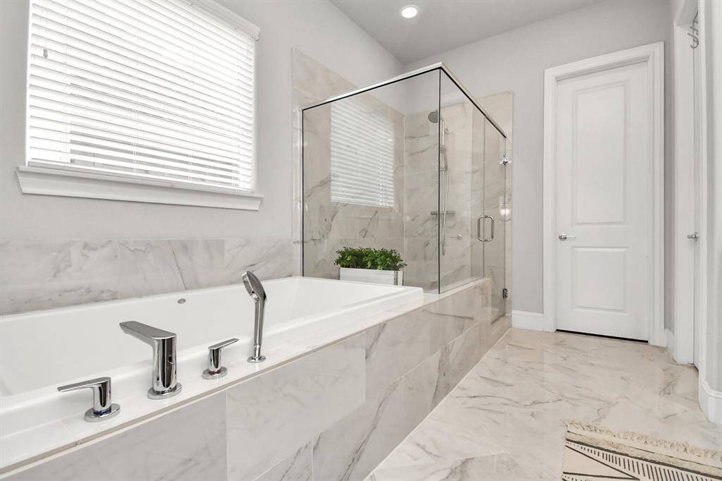Separate bathtub and shower.