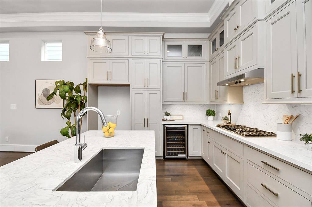 The kitchen features top-of-the-line stainless steel appliances, custum soft closing cabinets and quartz countertops.
