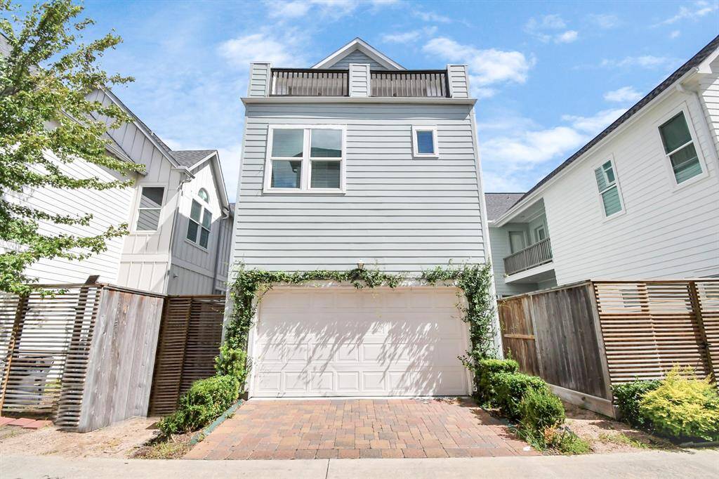 This 3-story home has 2 private balconies and a small side yard. You can see the large balcony on the third floor and attached garage for 2 cars!