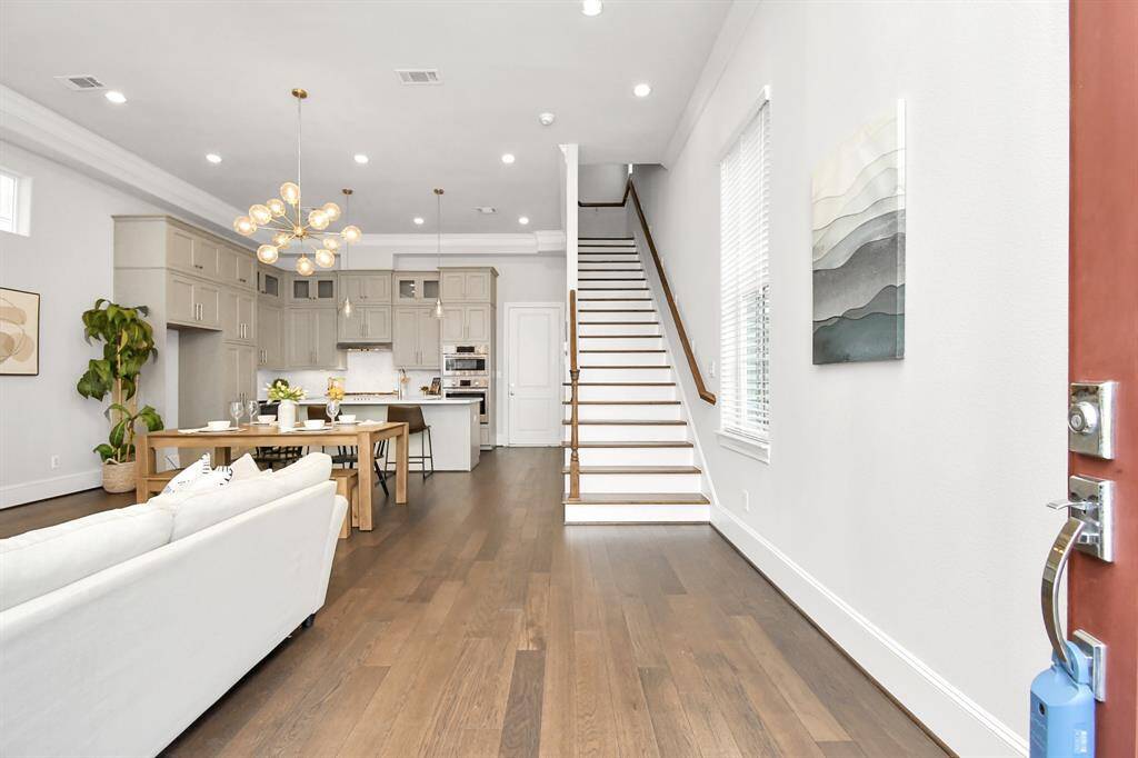 View from the entrance door. It opens to a spacious open concept filled with natural light.