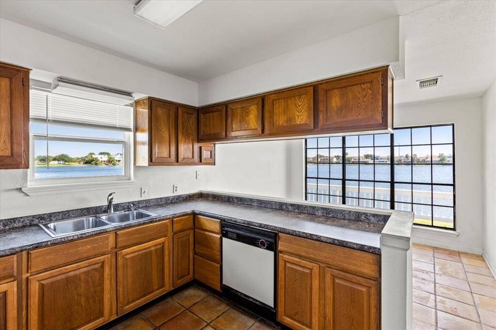 This is a kitchen that offers natural light and scenic vistas.
