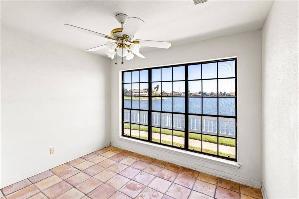 The space includes a ceiling fan for comfort and tiled flooring, suggesting a low-maintenance and versatile dining area.