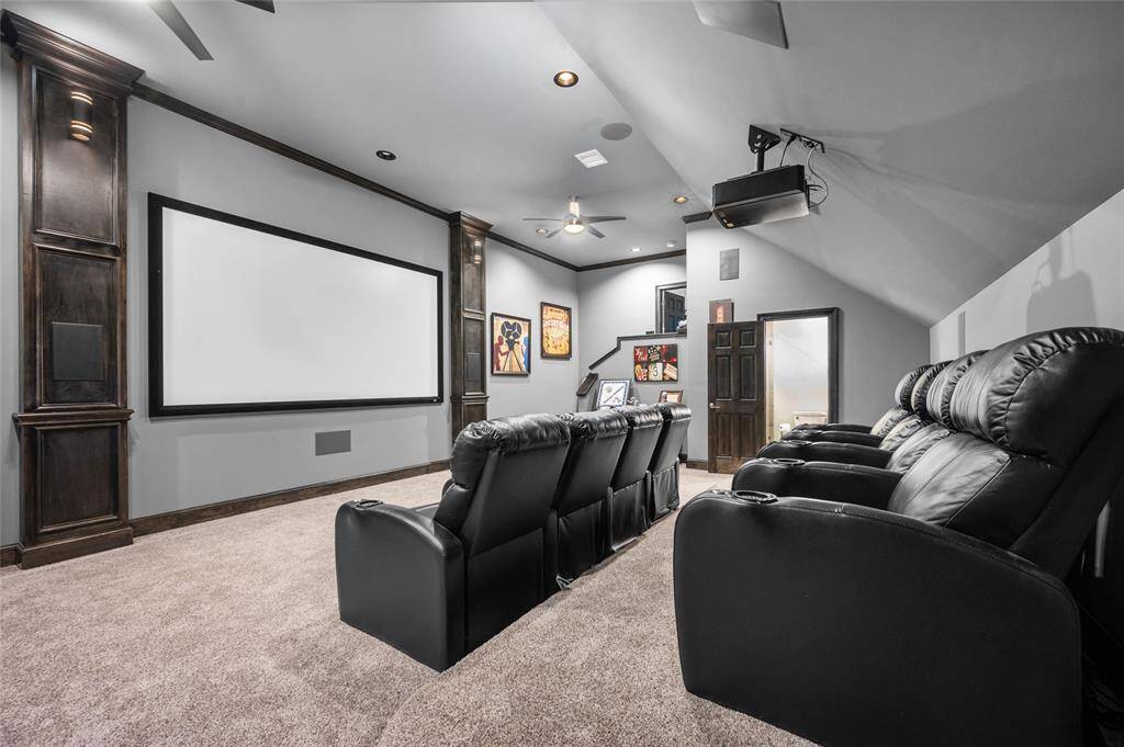 This upstairs media room is a binger's paradise. Large screen, 11 speaker system with two subwoofers and 4k DILA projector.