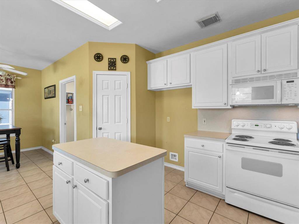 Even with all the storage in the kitchen, you also have a roomy walk-in pantry! The laundry room and entry into garage is right off the breakfast room.