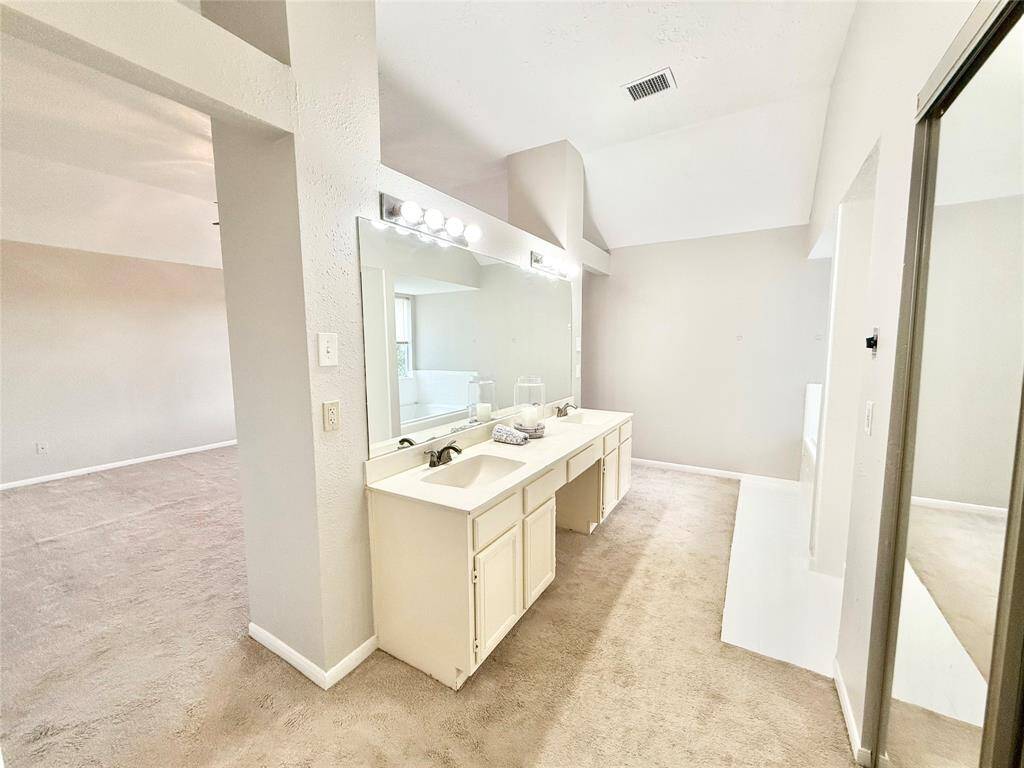 Primary Bathroom is spacious with double sinks.