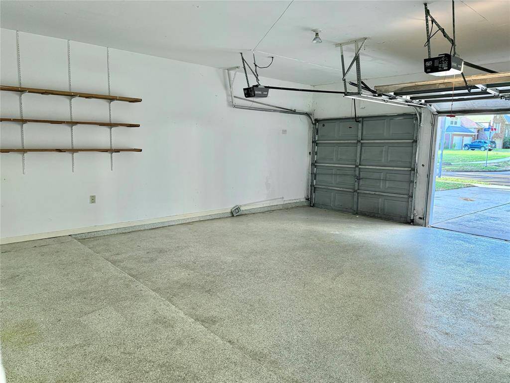 Garage has an extended area for bicycles and/or other storage.