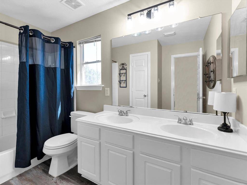 Secondary bath has double sinks so no fighting over the space!