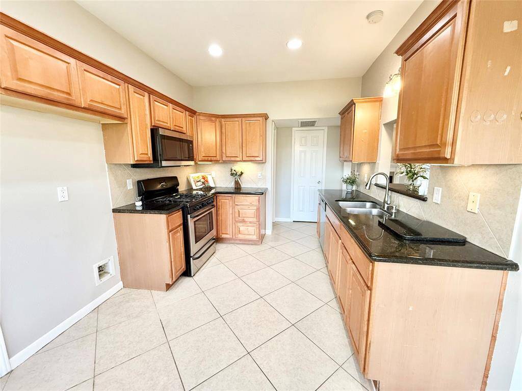 A view of the kitchen from the breakfast nook