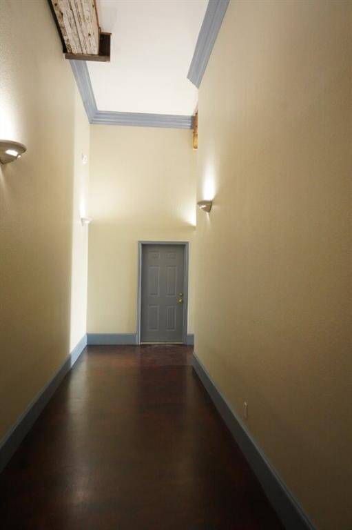 Interior hallway to access garage from kitchen door of condo