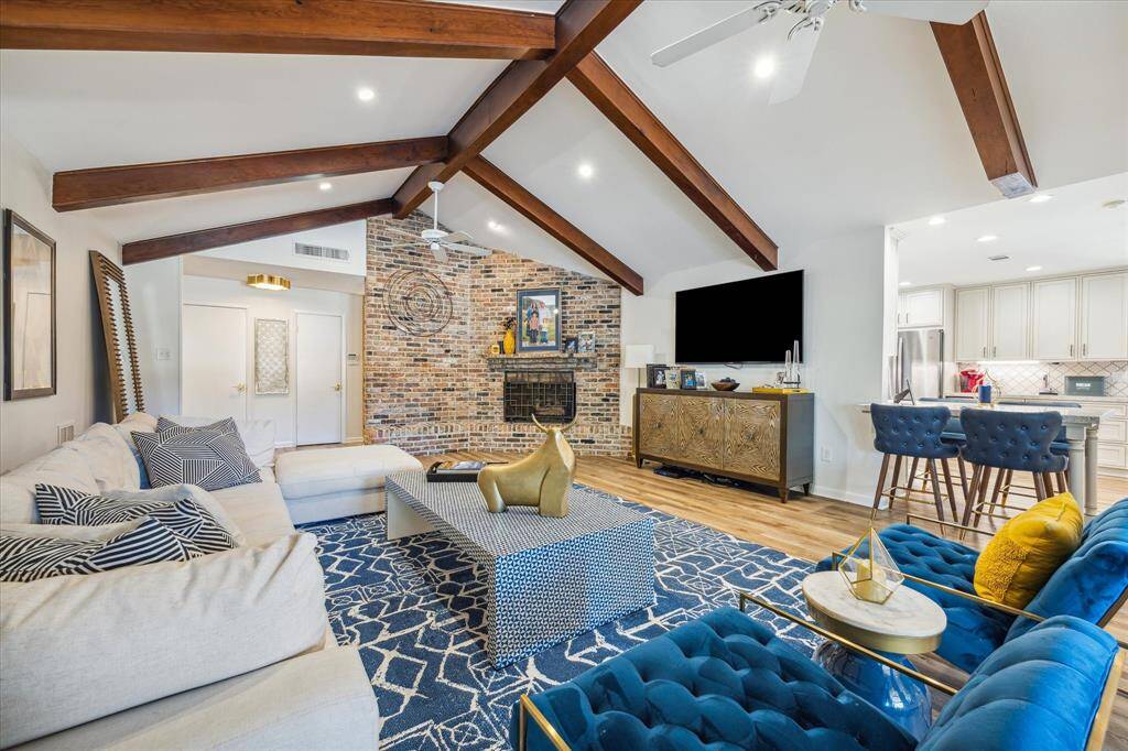Spacious living room opens to kitchen, entry and dining rooms