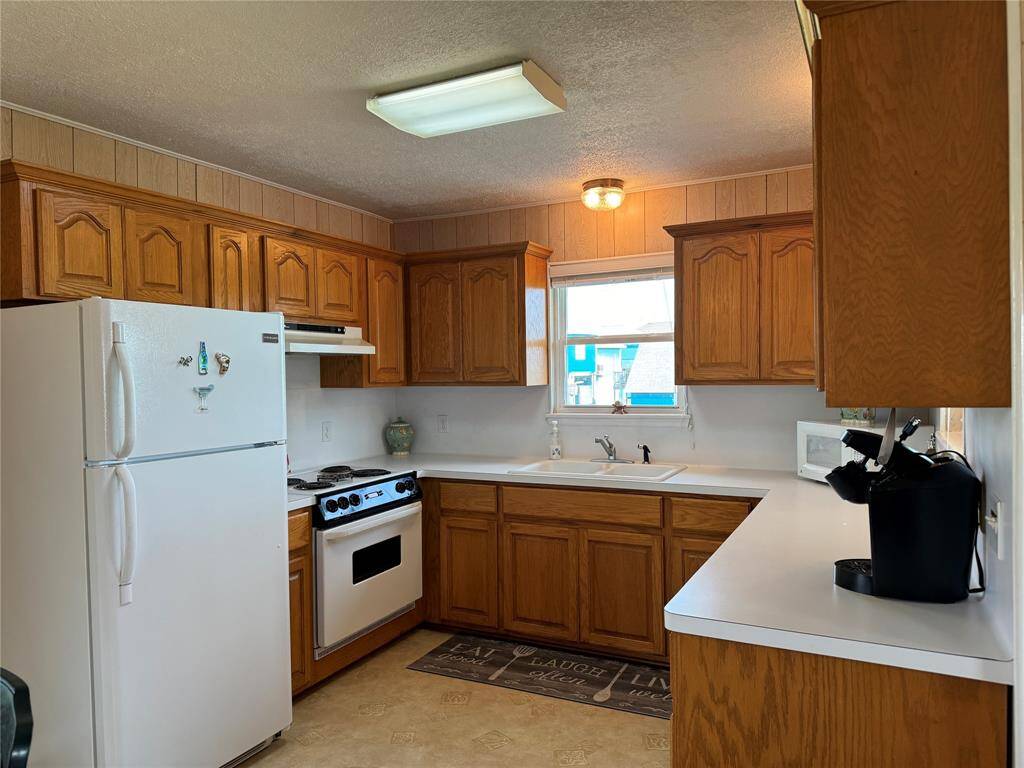Serene primary suite with abundant natural light and cozy ambiance, offering a peaceful retreat.