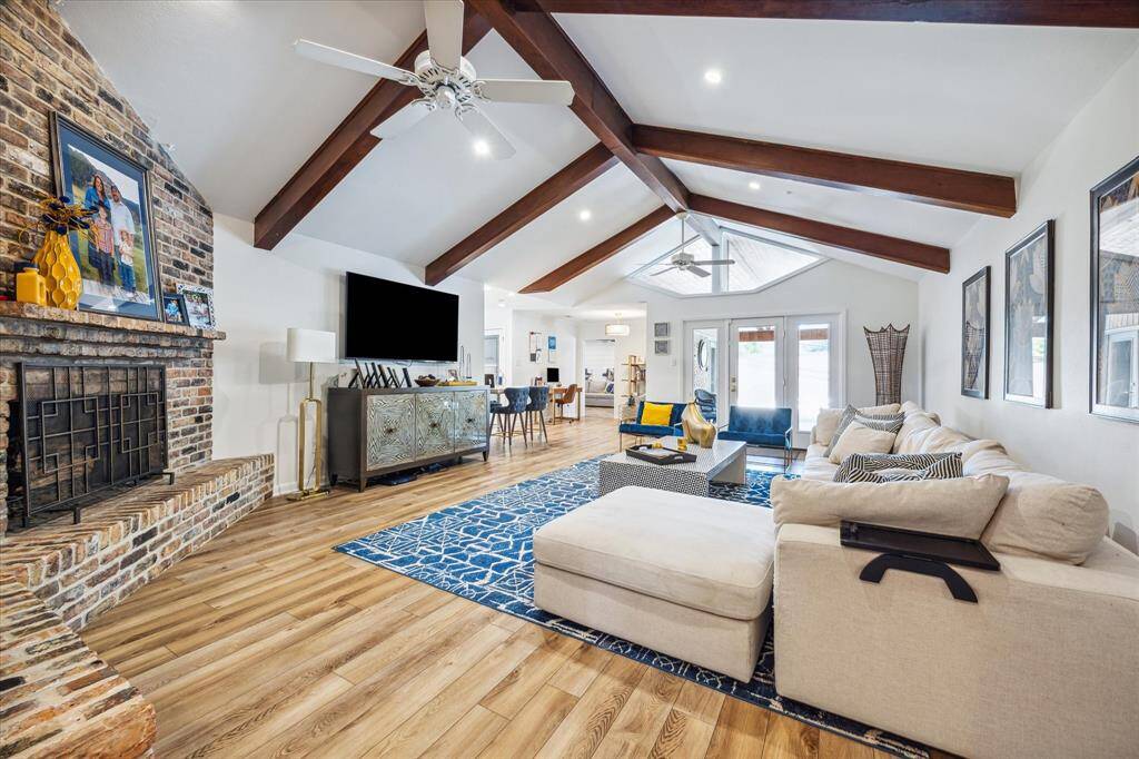 French Doors open to covered entertaining area and pool