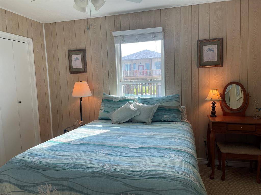 Charming Primary Bedroom with Natural Light and Serene View