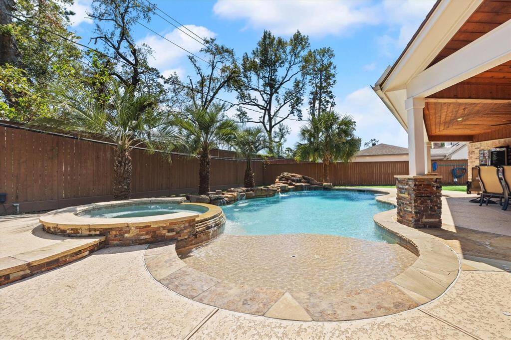 Spa, pool with rock waterfall and water features