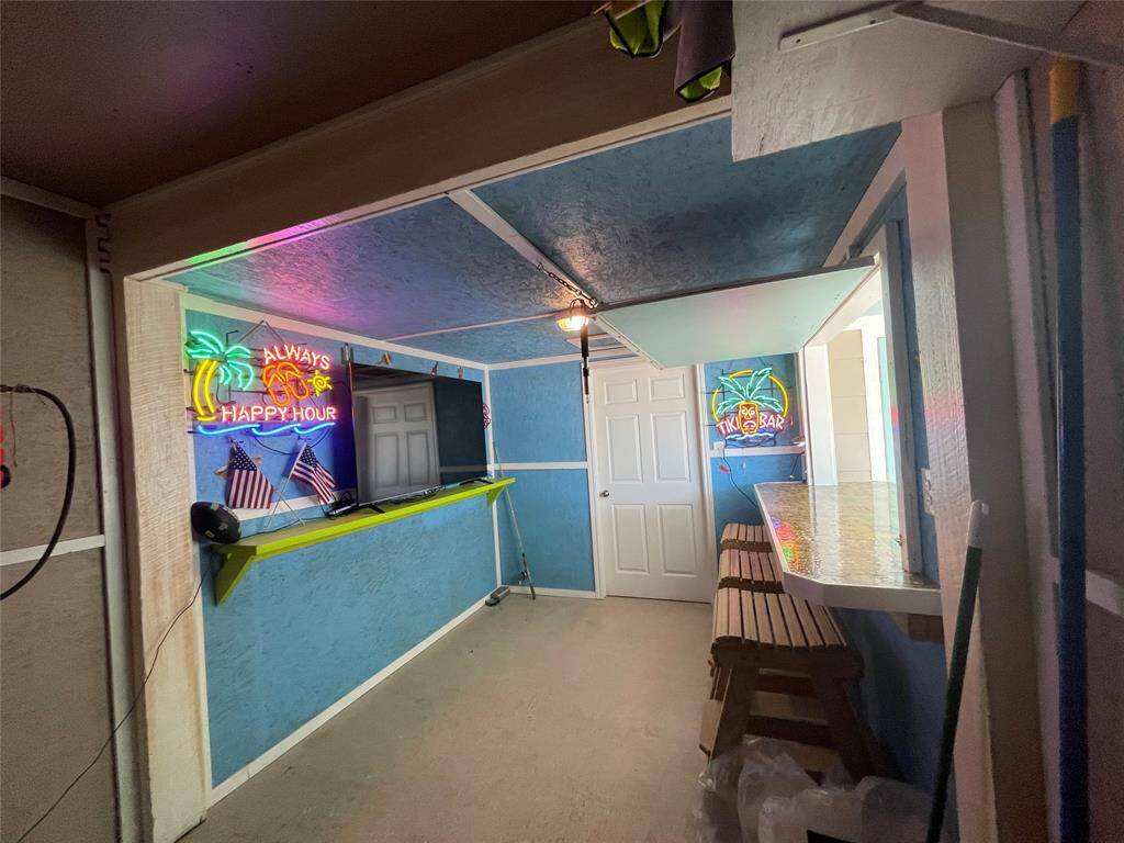 Inviting Entertainment Space with Custom Bar