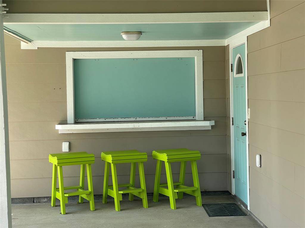 Chic lime green bar stools at an outdoor serving window, perfect for enjoying refreshments and conversation.