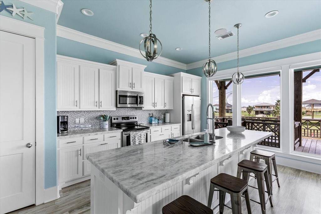 Kitchen area with spacious island and bar seating.