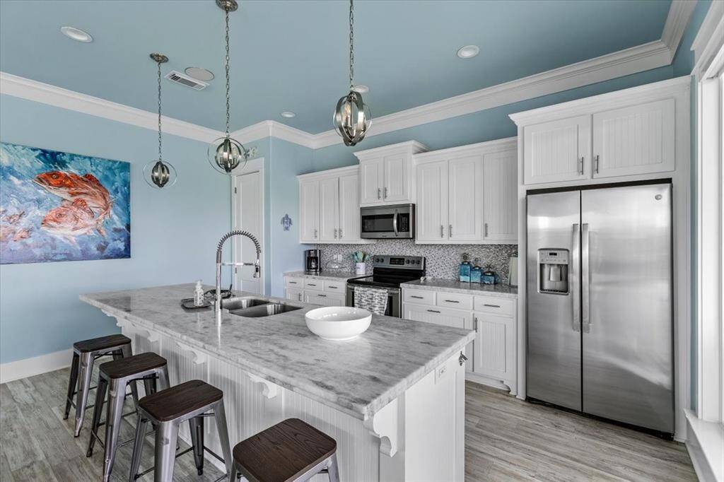 Kitchen includes updated appliances consisting of oven, microwave, dishwasher, and refridgerator.