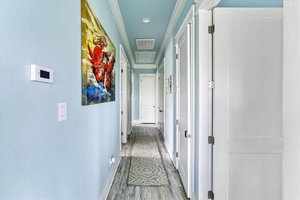 Off the family/kitchen area is the main hallway that leads to all bedrooms and storage closets.