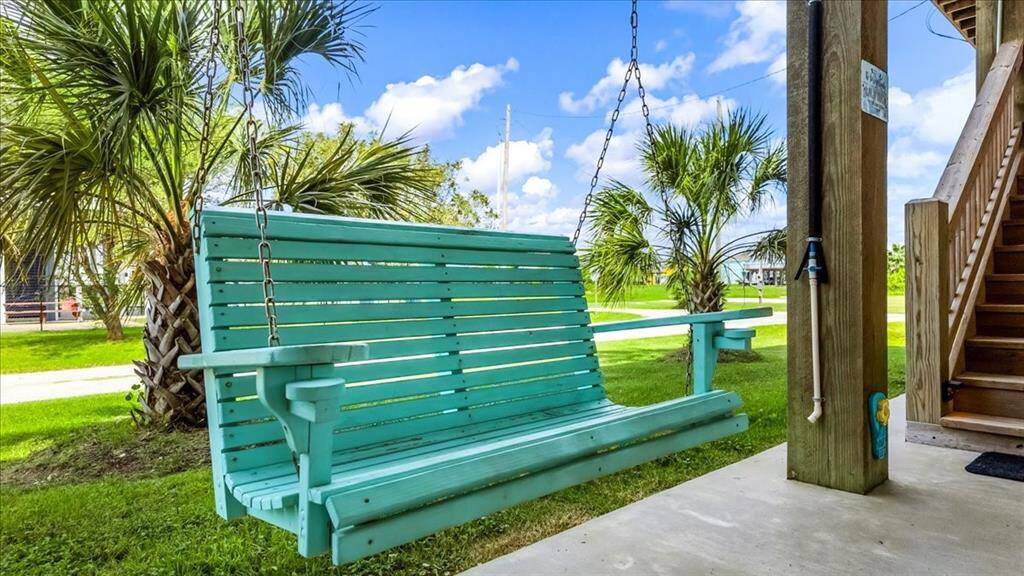Beautiful custom built swing included with the sale of the house.