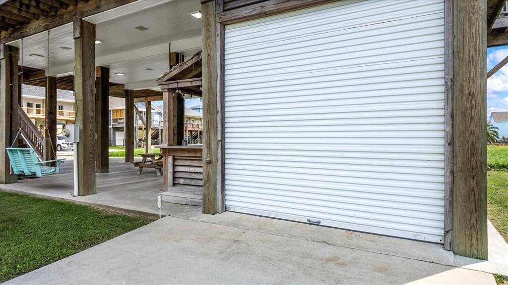 Garage has a separate driveway off the side of the house.