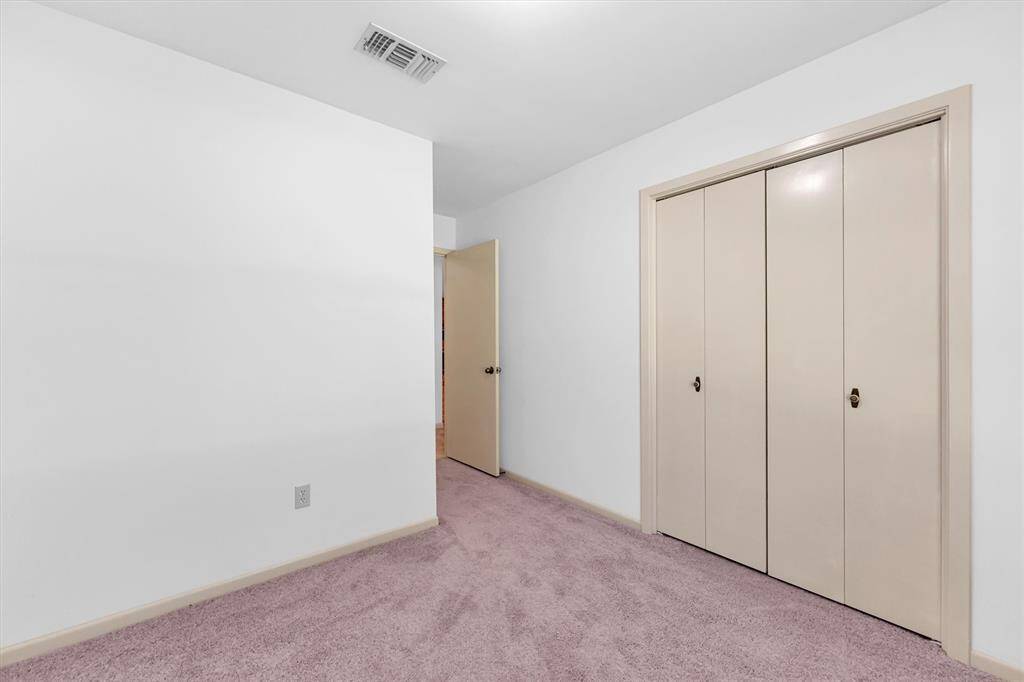 Bedroom 1 with additional closet space at the door way.