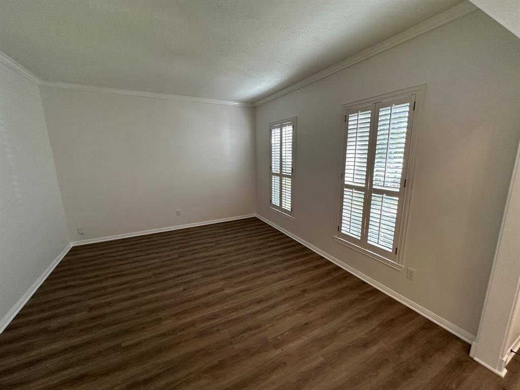 Formal living or study with Plantation Shutters.
