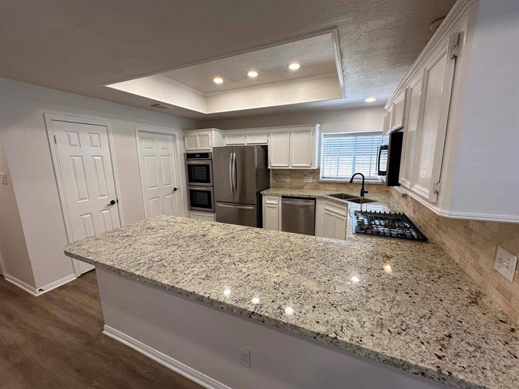 Updated kitchen with granite counters.