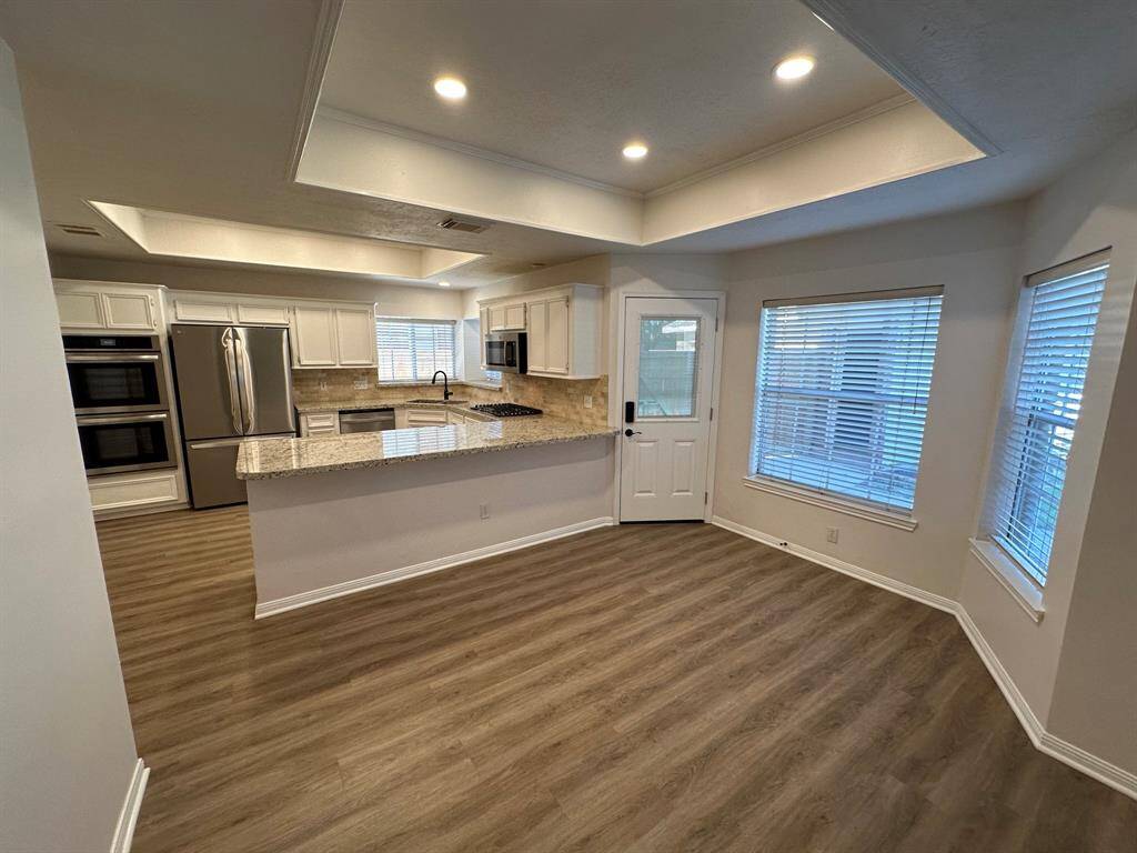 Spacious breakfast area overlooking back yard and patio.
