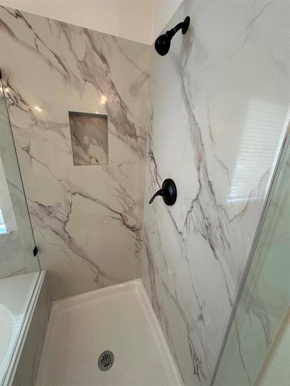 Built-in soap/shampoo niche.