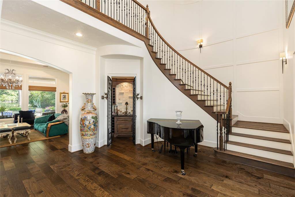 Grand stairway leads to home theater, bedrooms, more living area and more!