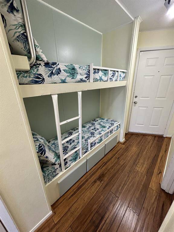 Bunk beds with condo front door in the background.