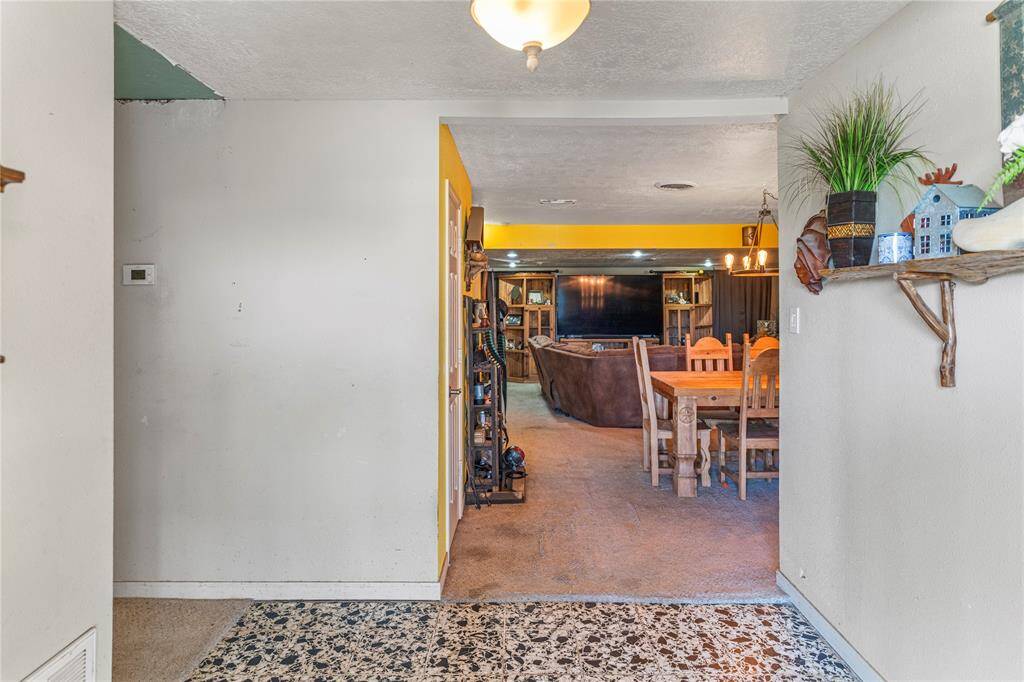 Foyer with a coat closet to the left