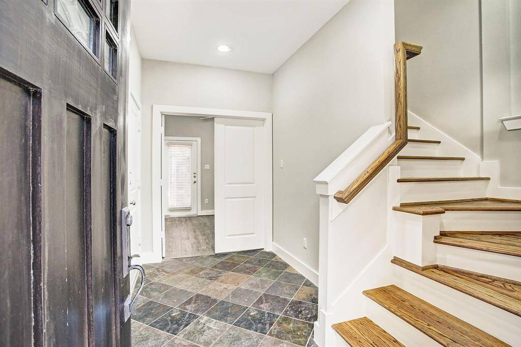 Bedroom on first floor can be easily used as office, second living area or guest suite. It has full bath and access to back yard