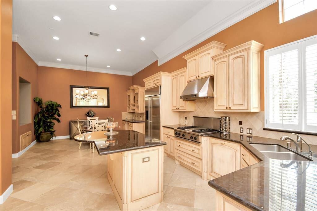 This chef's dream kitchen showcases custom cabinetry and generous storage.